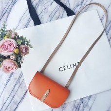 Pochette Celine arancione con cinturino in palma